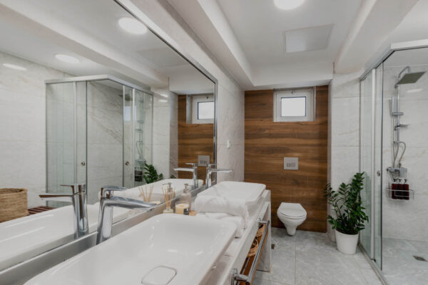 Modern Bathrooms at Hypnosis Villa with twin basins and a glass shower